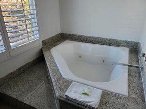 Hotels with Jacuzzi in Room Orange County: The Ultimate Relaxation Experience In the heart of Orange County, where luxury and comfort meet, there lies a hidden gem for those seeking the perfect blend of relaxation and coastal charm. Imagine waking up to the soothing sounds of the Pacific Ocean, breathing in the fresh Orange County air, and indulging in the ultimate relaxation - a jacuzzi in your room. In this article, we'll explore the world of hotels with jacuzzi in room Orange County and how you can upgrade your stay to a deluxe room for an unforgettable experience. Jacuzzi Room: A Slice of Paradise Regarding luxurious accommodations, nothing beats a room with a jacuzzi. These rooms are designed for those who seek a romantic getaway, a little extra pampering, or simply a moment of indulgence. The jacuzzi offers you the chance to unwind, whether you've spent the day at the beach or exploring Orange County's attractions. EVERY DAY IS A BEACH DAY One of the standout features of these hotels is their proximity to the beach. Guests can start their day with the soothing sounds of the ocean, followed by a delicious continental breakfast. It's an invitation to live the quintessential SoCal lifestyle, and it's all right at your doorstep. Access to the beach is just steps away, making it perfect for surfers, vacationers, wanderers, and travelers seeking an authentic Orange County escape. Room with a Spa Bath The spacious double rooms in these hotels are equipped with air conditioning, a coffee machine, and a private bathroom with a walk-in shower and a bath. Enjoy the comfort of carpeted floors, a seating area with a flat-screen TV, a wardrobe, a safe deposit box, and heating. It's a home away from home with a touch of luxury. Explore the Area Besides the beach, these hotels are conveniently located near popular attractions. Disneyland is just a 30-minute drive away, and you can explore the Aquarium of the Pacific or visit the historic Queen Mary, both within a reasonable distance. Long Beach Airport and John Wayne Airport are also easily accessible. STAY BY THE BEACH With only 30 rooms, you can expect a more peaceful and intimate stay. The rooms have various amenities, including a continental breakfast, refrigerator, microwave, coffee maker, and complimentary WiFi access. For an even more extraordinary experience, you can upgrade to one of their deluxe jacuzzi rooms with partial views of the Pacific Ocean, and some even have balconies. Fall in Love with Sunset Beach Sunset Beach is a quaint seaside community less than two miles long, offering a romantic setting for couples and an ideal spot for surfers. It's a paradise for those who love the ocean, and the waves here are perfect for surfers of all levels. Sunset Beach offers something unique, whether you're seeking a weekend getaway or a more extended escape. Drink Up. Eat Up Being close to the ocean comes with its perks, and one of the most significant advantages is the incredible seafood. Sunset Beach boasts a wide selection of restaurants, bars, and cafes. Savor the taste of the sea at Sam's Fish & Chips, indulge in an artisanal sandwich and beer at Brix Sunset Beach, enjoy a romantic Italian dinner at Romano Cucina Sunset Beach, or grab some comfort food at Woody's Diner. From independent juicers to gourmet eateries, there's something for every taste and budget. Conclusion Hotels with jacuzzi in room Orange County offer the perfect blend of luxury, comfort, and beachside charm. Whether you're a surfer, a couple seeking romance, or a traveler searching for the authentic Orange County experience, these hotels provide a unique and memorable stay. FAQs Q. Do all rooms have jacuzzis in these hotels? Some rooms offer jacuzzis, while others have standard amenities. You can inquire about jacuzzi availability when booking. Q. Is breakfast included in the room? Yes, a complimentary continental breakfast is offered to all guests. Q. Are these hotels suitable for families with children? These hotels are more geared toward couples and adults, but families are welcome. Q. What are the nearby attractions in Orange County? Disneyland, the Aquarium of the Pacific, and the Queen Mary are all within a reasonable drive from these hotels. Q. Are pets allowed in these hotels? It's best to check with the hotel's pet policies, as they may vary. Experience the beauty of Orange County like never before. Upgrade your stay to a jacuzzi room, and create lasting memories as you relax by the beach in Sunset Beach. Get Access Now: Book Your Jacuzzi Room